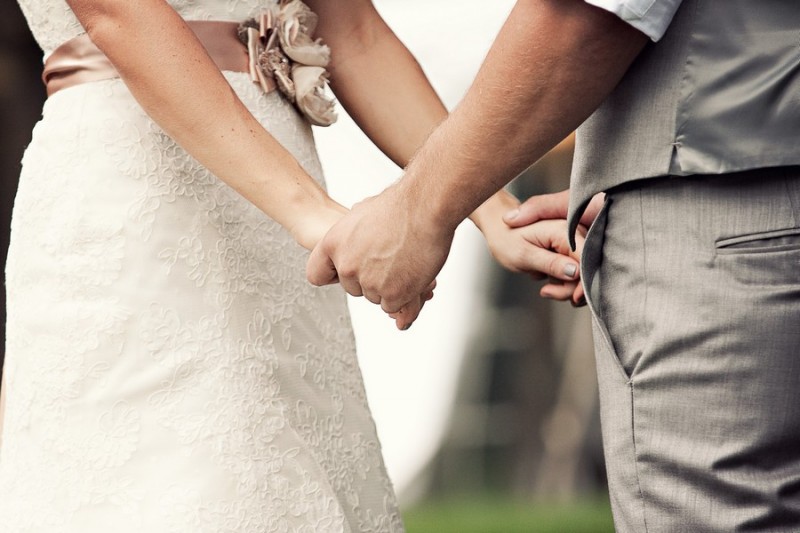 Photograph of bride and groom holding hands by Connecticut Wedding Photographer