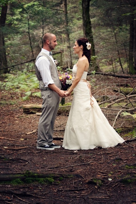 Photograph of bride and groom in the woods by Connecticut Wedding Photographer